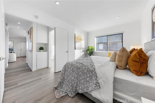 bedroom with light hardwood / wood-style floors