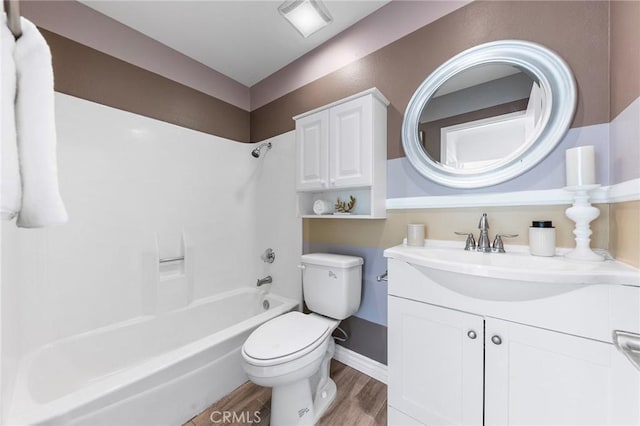 full bathroom with toilet, shower / bath combination, wood-type flooring, and vanity