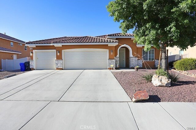 view of front of property featuring a garage