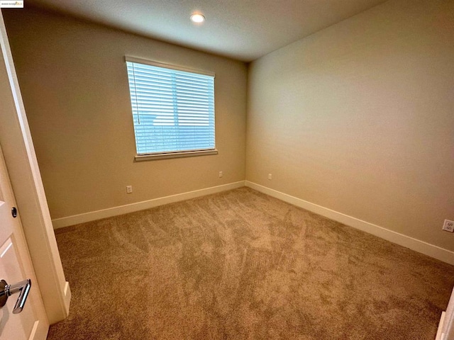 empty room with light colored carpet