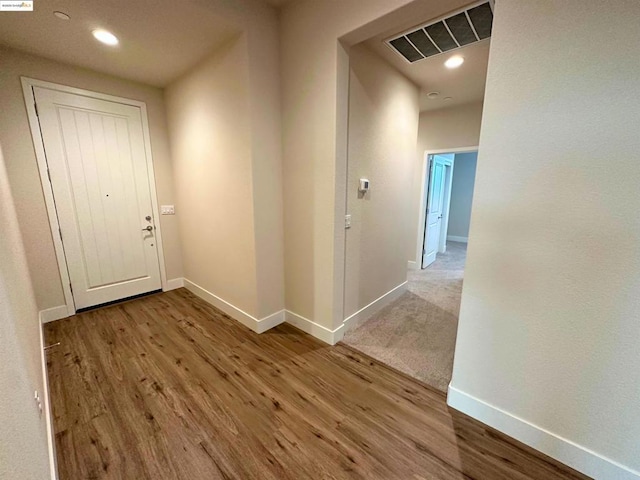 corridor featuring light hardwood / wood-style floors