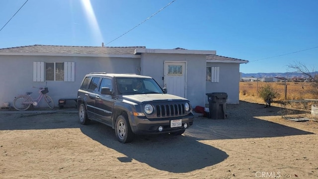 view of side of home with a mountain view