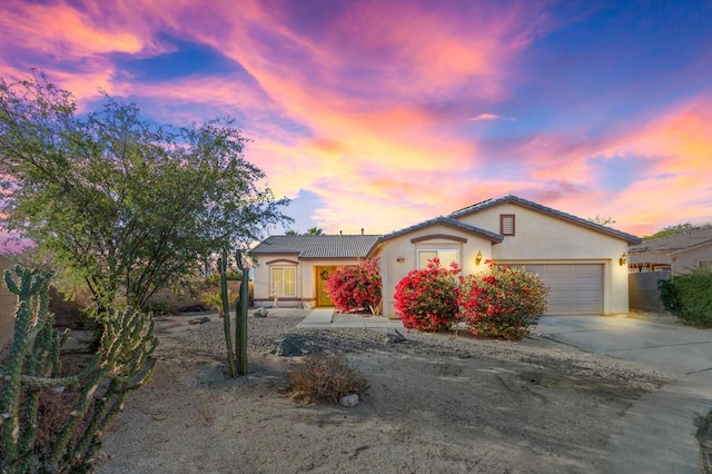 view of front of property with a garage