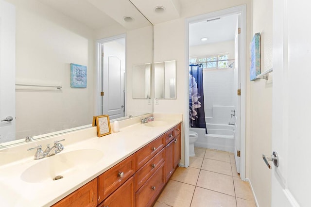 full bathroom featuring tile patterned floors, toilet, vanity, and shower / bathtub combination with curtain