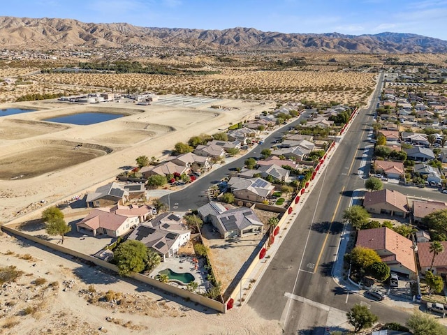 birds eye view of property featuring a mountain view