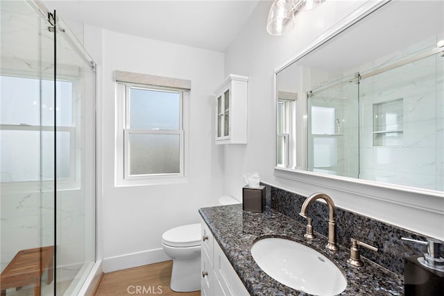 240 Moss St Unit 4, Laguna Beach, CA 92651 - bathroom featuring toilet, a marble finish shower, vanity, and wood finished floors