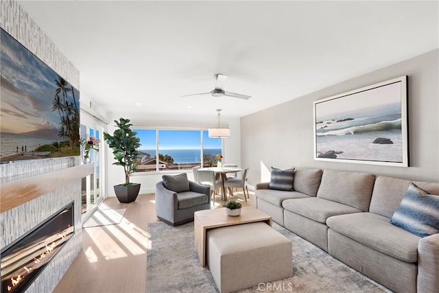 240 Moss St Unit 4, Laguna Beach, CA 92651 - living area featuring wood finished floors, a fireplace, and a ceiling fan