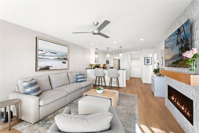 240 Moss St Unit 4, Laguna Beach, CA 92651 - living room featuring light wood-type flooring, a ceiling fan, a fireplace, and recessed lighting