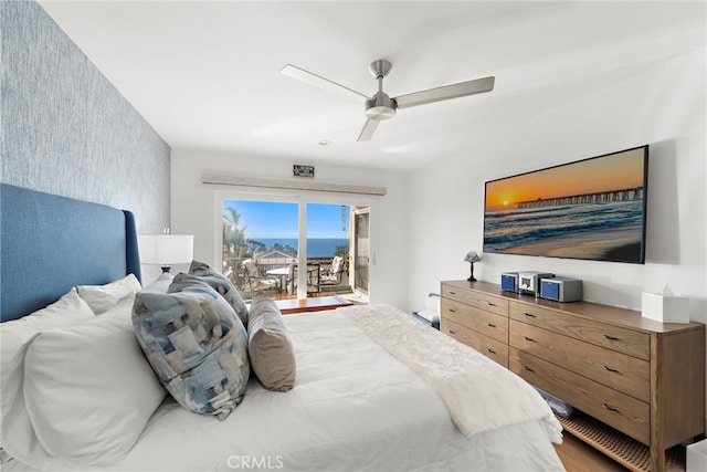 240 Moss St Unit 4, Laguna Beach, CA 92651 - bedroom featuring access to outside, an accent wall, ceiling fan, wallpapered walls, and wood finished floors