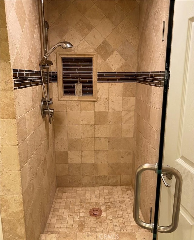 bathroom featuring an enclosed shower