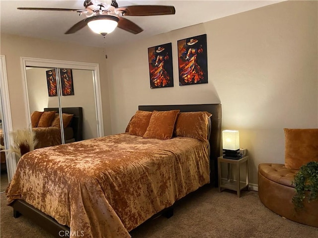 bedroom with ceiling fan, carpet floors, and a closet