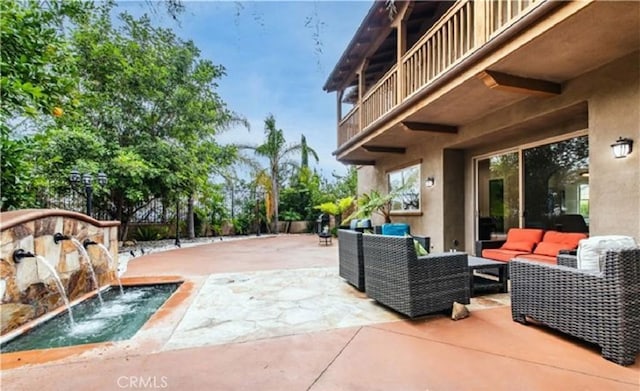 view of patio / terrace featuring an outdoor hangout area and a balcony