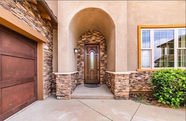 entrance to property featuring a garage