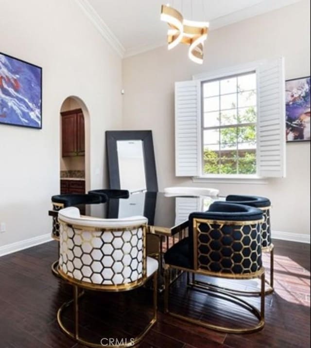 sitting room featuring ornamental molding, lofted ceiling, and wood-type flooring