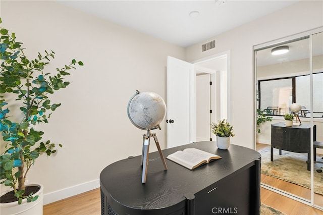 home office with light wood-type flooring