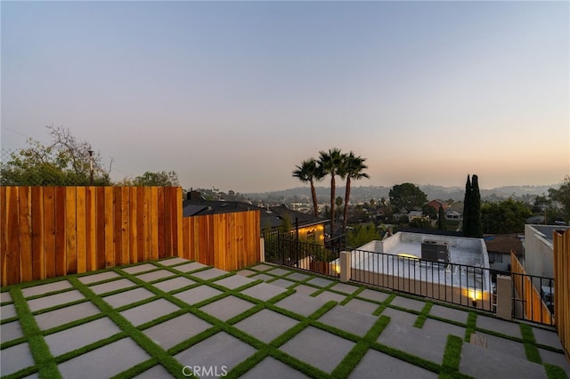 view of patio terrace at dusk