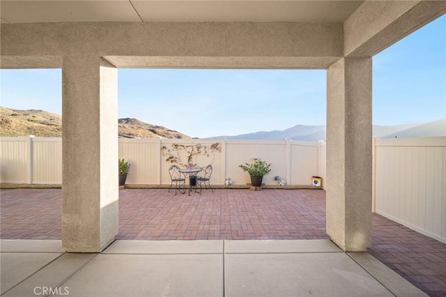 view of patio with a mountain view