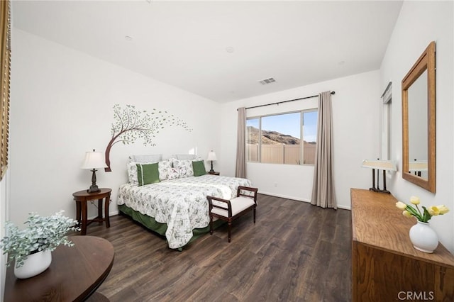 bedroom featuring dark wood-type flooring