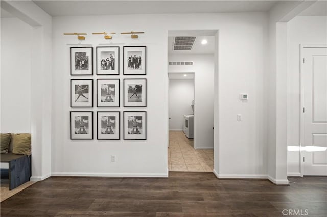 hallway with dark hardwood / wood-style flooring