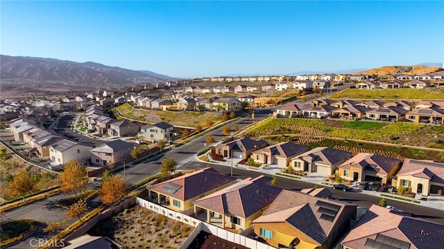 birds eye view of property featuring a mountain view