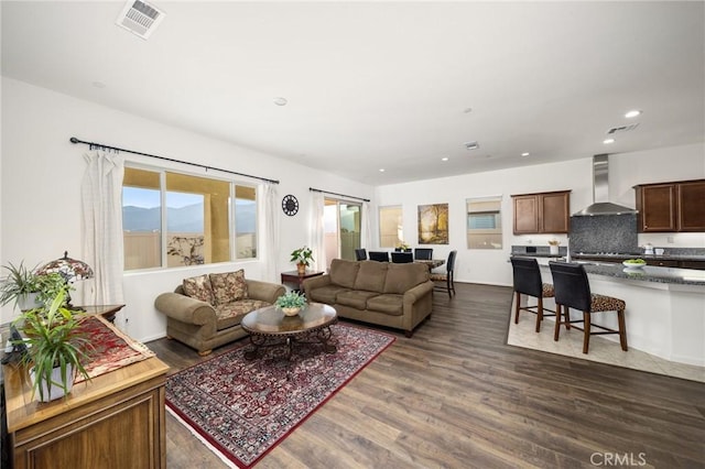 living room featuring dark hardwood / wood-style flooring