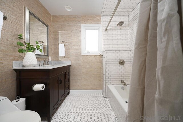 full bathroom featuring toilet, shower / tub combo, tile patterned floors, and vanity