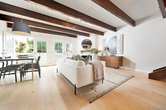 living room with light wood-type flooring, french doors, wood ceiling, and beamed ceiling