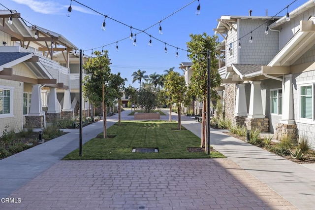 view of property's community featuring a lawn