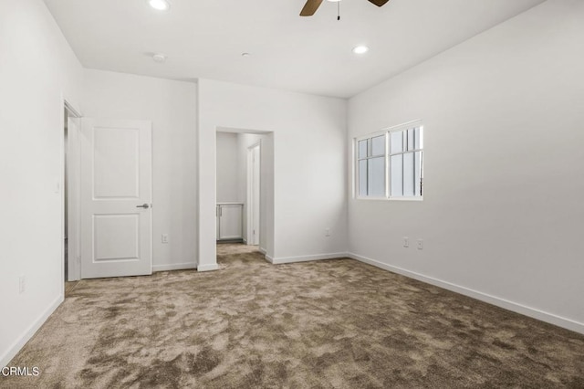 unfurnished bedroom with ceiling fan and carpet