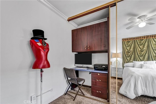 bedroom featuring ceiling fan, light colored carpet, a closet, and crown molding