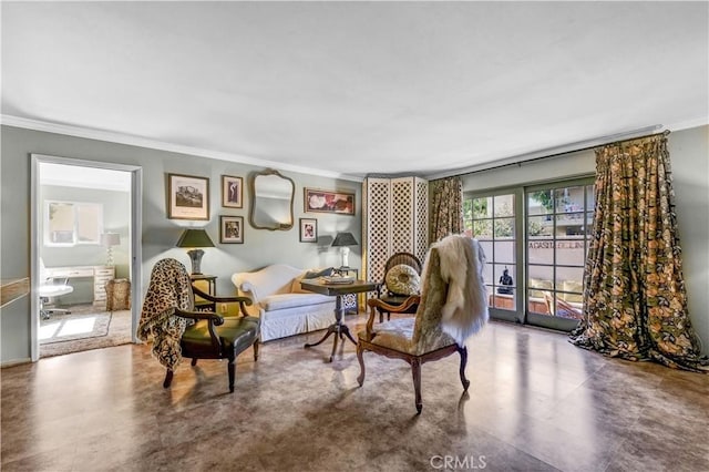 living area with crown molding