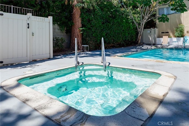 view of swimming pool with a patio area