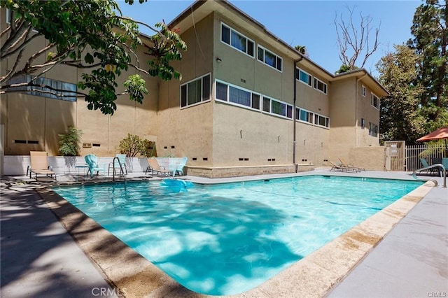 view of pool featuring a patio