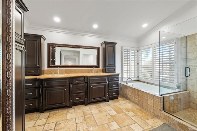 bathroom with vanity, vaulted ceiling, independent shower and bath, and crown molding