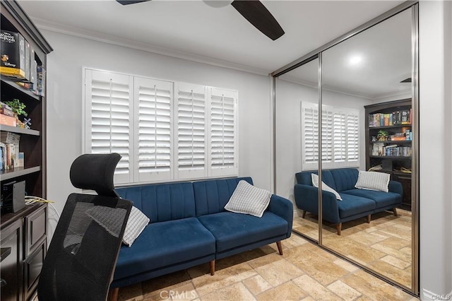 interior space with ceiling fan and ornamental molding