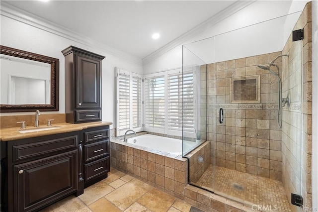 bathroom with lofted ceiling, vanity, crown molding, and shower with separate bathtub