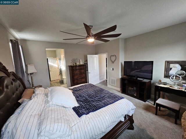 bedroom featuring ceiling fan and light colored carpet