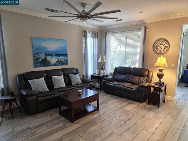 living room with ceiling fan and crown molding