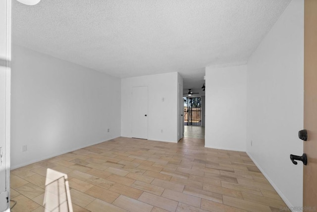 unfurnished room with ceiling fan