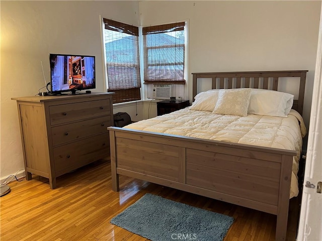 bedroom with light hardwood / wood-style floors