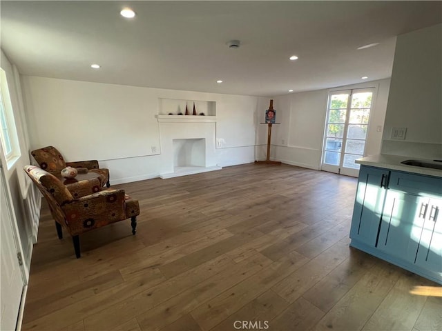 unfurnished living room featuring wood-type flooring