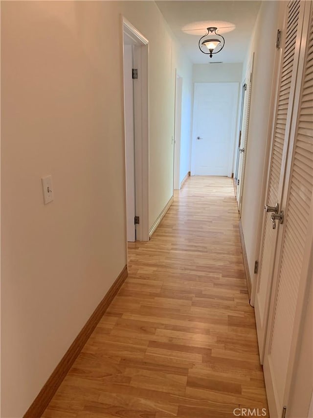 hallway featuring light wood-type flooring