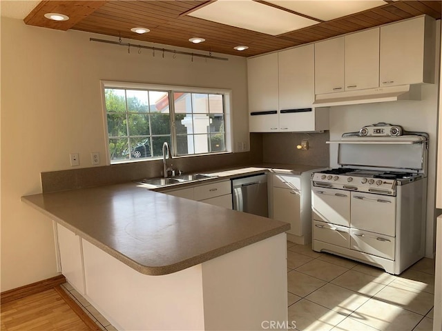 kitchen featuring kitchen peninsula, wooden ceiling, stainless steel dishwasher, white cabinets, and sink