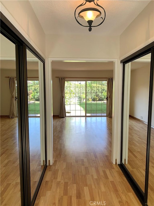 corridor featuring light hardwood / wood-style flooring