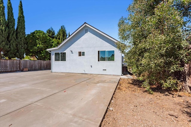 view of property exterior featuring a patio