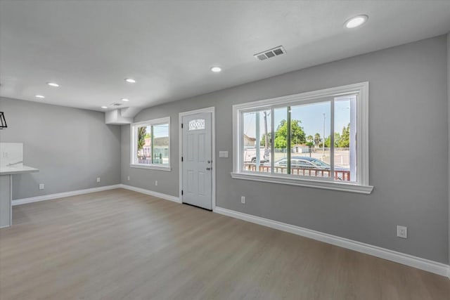 entrance foyer featuring a healthy amount of sunlight and light hardwood / wood-style flooring