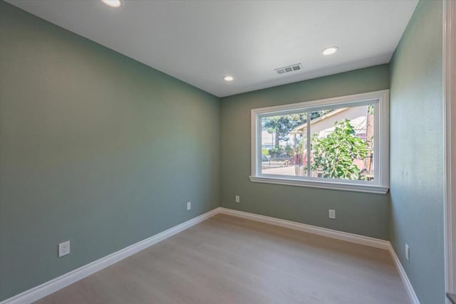 empty room with light hardwood / wood-style floors