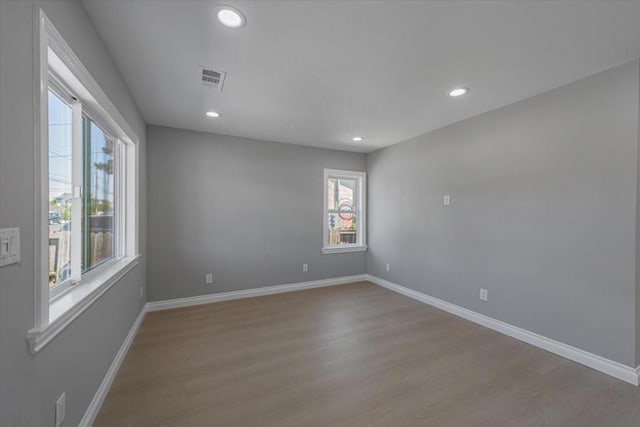 spare room with light hardwood / wood-style floors