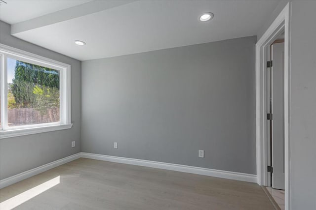 spare room featuring light hardwood / wood-style flooring