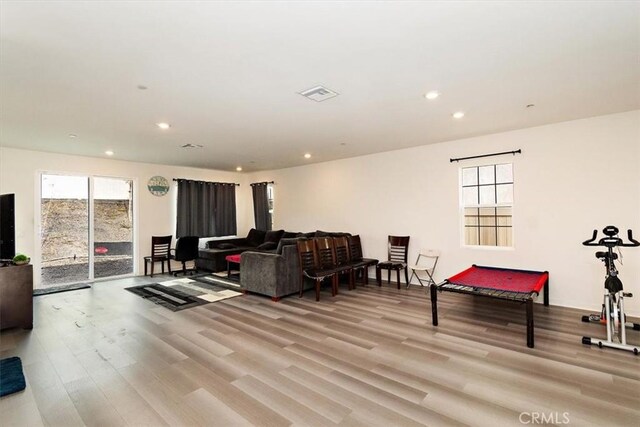 living room featuring billiards and light wood-type flooring